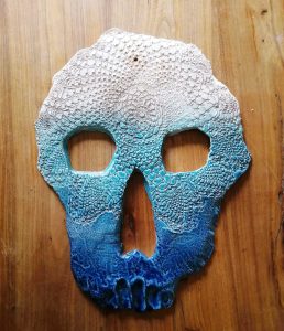 "Skull" by Laura Rambelli transforms the concept of mortality into a celebration of life. This ceramic piece combines craftsmanship with symbolism, inviting viewers to contemplate the harmony between life and death.