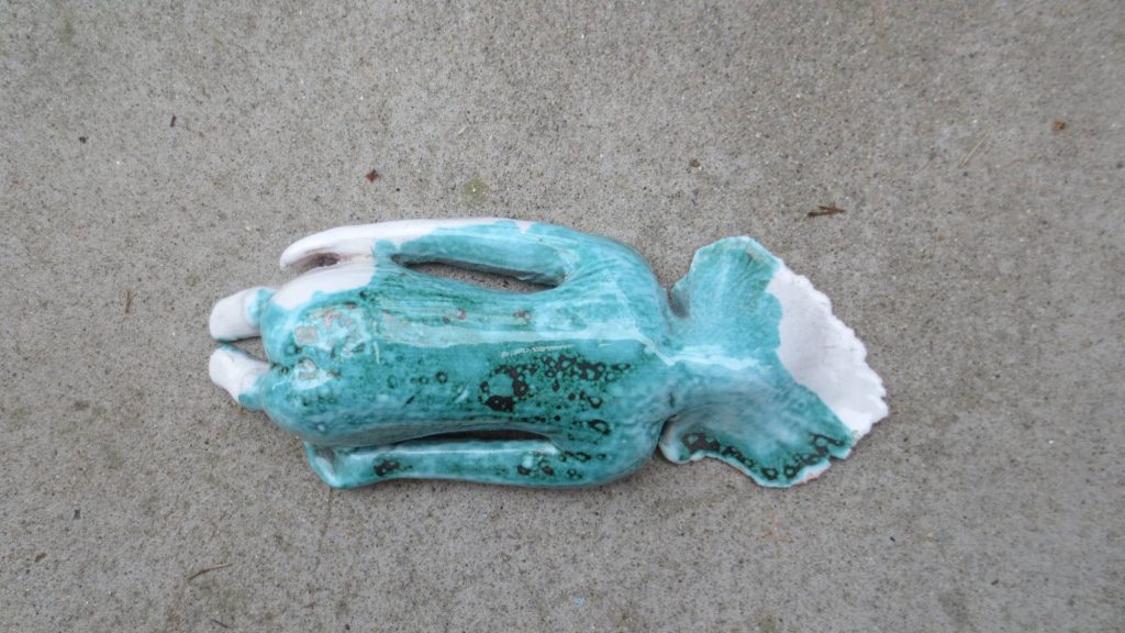 Micro Balasana" by Laura Rambelli captures the essence of tranquility and introspection. This delicate glazed ceramic piece depicts a female figure in the child’s pose, offering a moment of deep connection with oneself and nature.